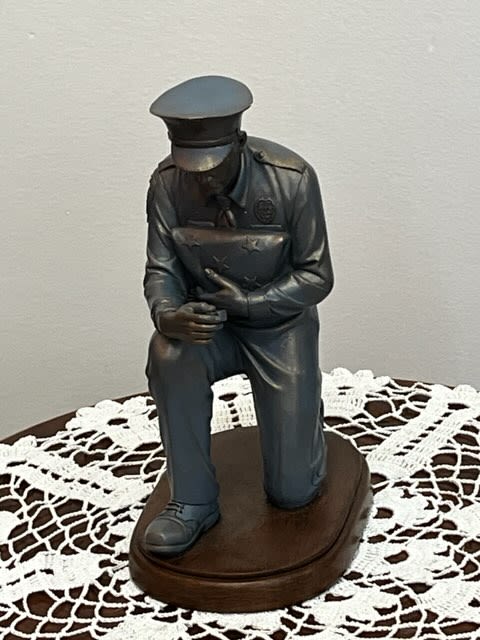 Kneeling Police Officer Figurine